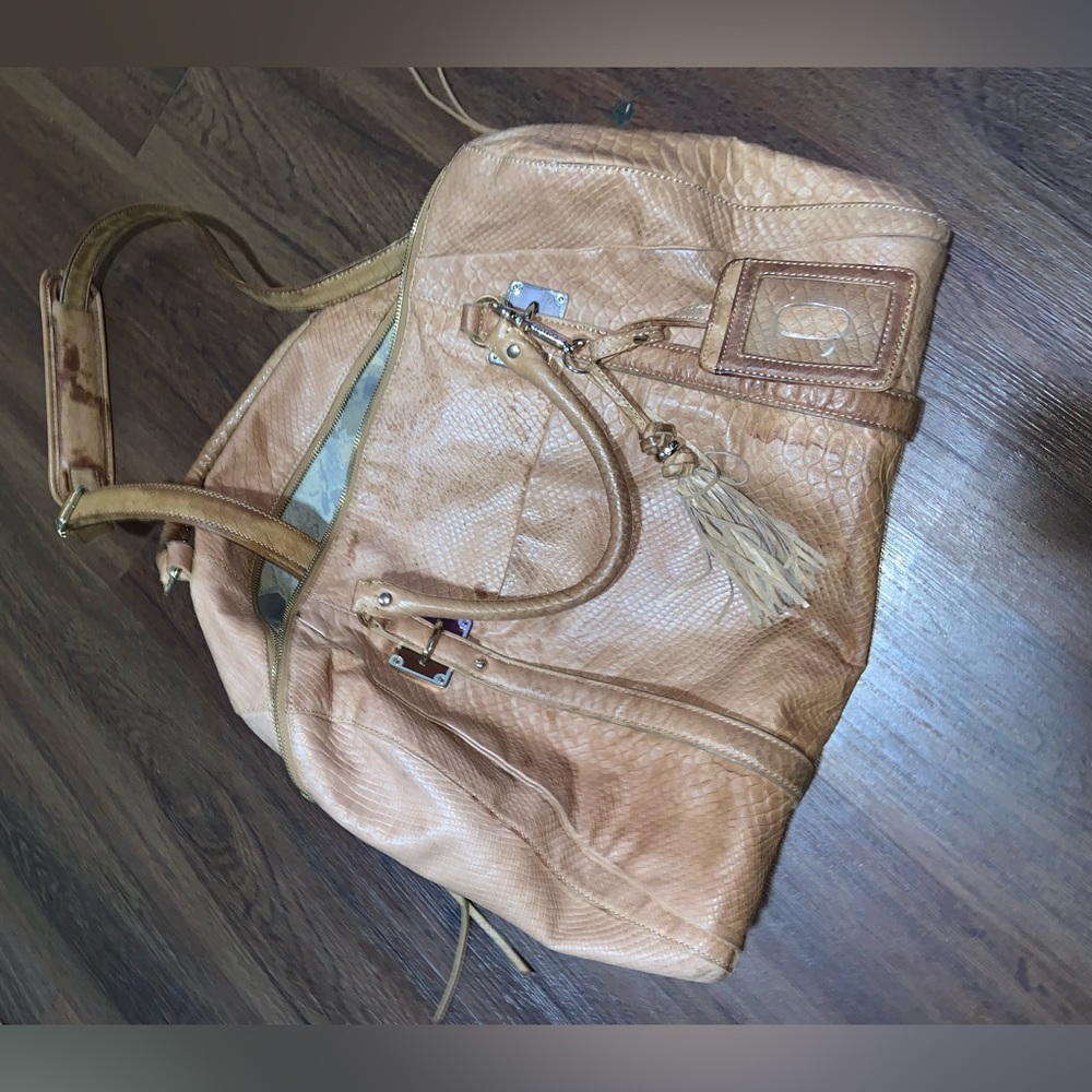 Elliott lucca tan duffel bag logo tassel leather $248 boho western luggage fall